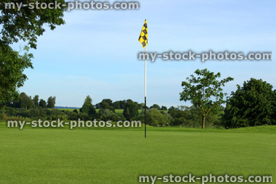 Stock image of flag / hole / putting green at scenic golf course