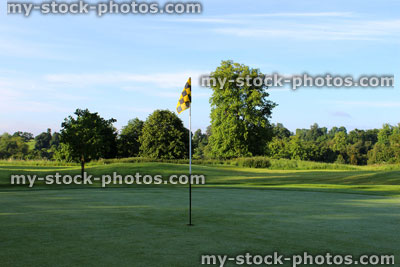 Stock image of flag / hole / putting green at scenic golf course