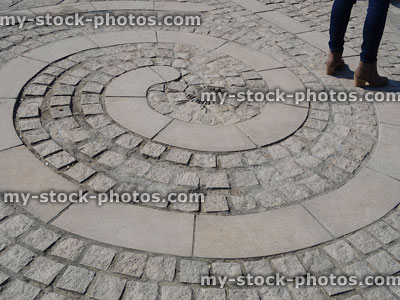 Stock image of paving with spirals / circles of flagstones, granite blocks