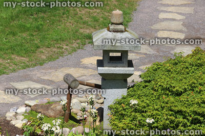 Stock image of oribe granite lantern and deer scarer, Japanese garden