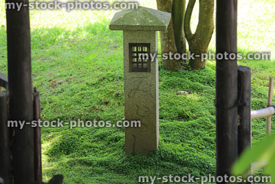 Stock image of oriental granite guide lantern / pillar path post, Japanese garden