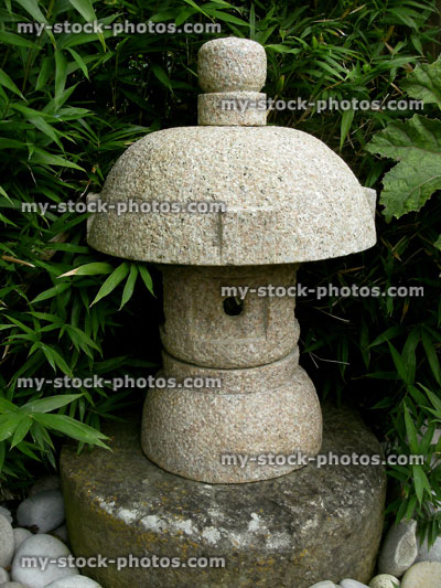 Stock image of Japanese granite stone lantern in oriental garden, bamboo