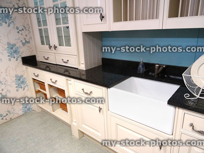 Stock image of cottage kitchen, black granite worktop, Belfast butler sink