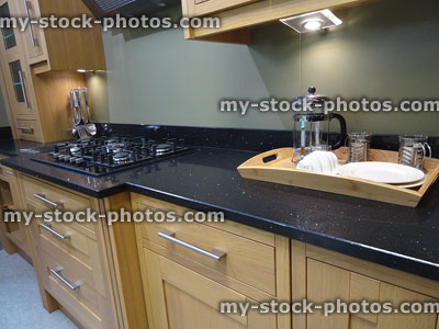 Stock image of breakfast tray on sparkly black granite kitchen worktop
