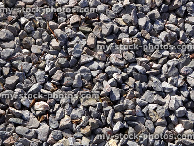 Stock image of medium grade grey gravel stones / grit, limestone chippngs, aggregate