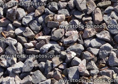 Stock image of medium grade silver gravel stones / limestone grit chippings, aggregate mulch