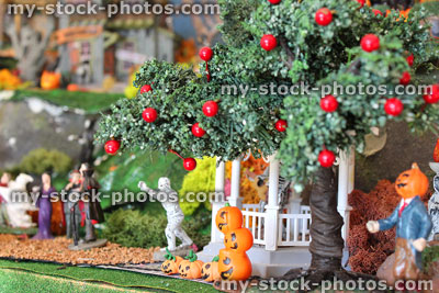 Stock image of model pumpkins, apple-tree and monsters in Halloween village