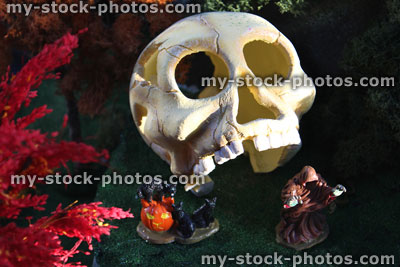 Stock image of Halloween village with clay skull and autumn trees