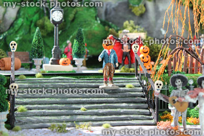 Stock image of model Halloween village / spooky town, miniatures, pumpkins, pumpkin head man, skulls, staircase