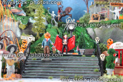 Stock image of model Halloween spooky town / village, miniatures, pumpkins, Dracula vampire figurine, haunted