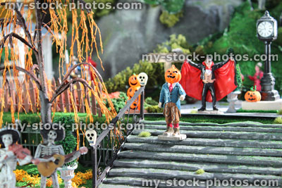 Stock image of model Halloween village / spooky town, miniatures, pumpkins, pumpkin head man, skulls, staircase