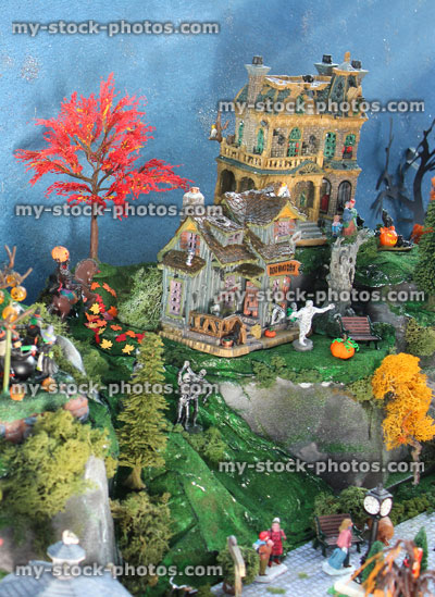 Stock image of model Halloween spooky town / village, miniature people, fall autumn, haunted house, pumpkins