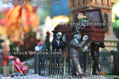 Stock image of model Halloween spooky town / village, miniatures, skeletons carrying coffin, graveyard cemetery
