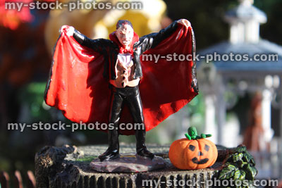 Stock image of model Halloween town / village, miniatures, Lemax Dracula vampire figurine, pumpkin