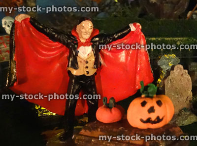 Stock image of model Halloween Spooky town, haunted house, coloured lights, night, Dracula, pumpkins