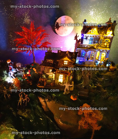 Stock image of model Halloween Spooky town / village, haunted house, coloured lights, night, night time