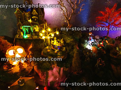 Stock image of model Halloween Spooky town / village, haunted house, coloured lights, night, night time