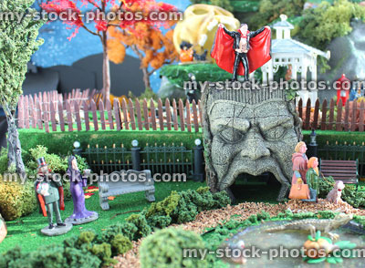 Stock image of model Halloween spooky town / village, miniatures, people, Dracula vampire, pumpkins, Frankenstein head