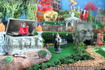 Stock image of model Halloween town / village, miniatures, skull figure, animated grim reaper chest