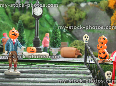 Stock image of model Halloween village / spooky town, miniatures, pumpkins, pumpkin head man, skulls, steps 