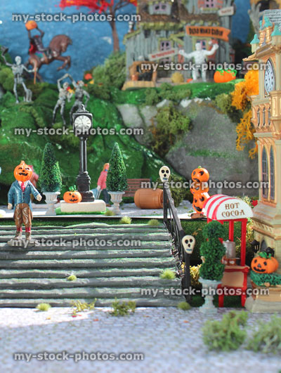 Stock image of model Halloween village / spooky town, miniatures, pumpkins, pumpkin head man, skulls, steps 