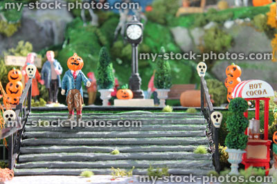 Stock image of model Halloween village / spooky town, miniatures, pumpkins, pumpkin head man, skulls, stairs