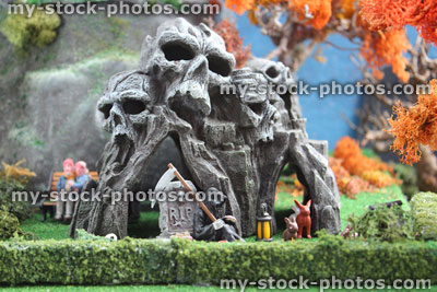 Stock image of model Halloween spooky town / village, miniature grim reaper, coffee break, skull mountain