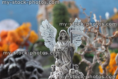 Stock image of model Halloween spooky town / village, Angel of Death statue, grim reaper, skull mountain