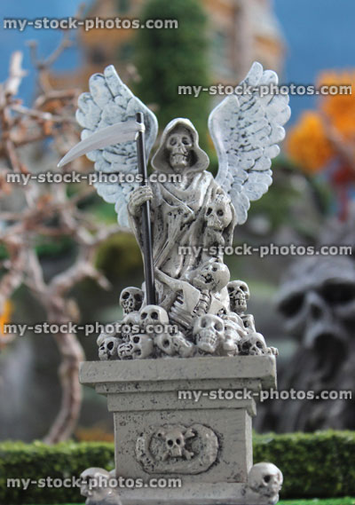 Stock image of model Halloween spooky town / village, miniature Grim Reaper / Angel of Death statue