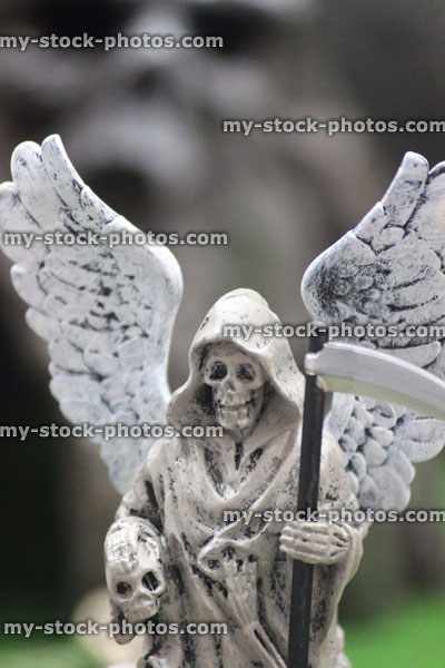 Stock image of model Halloween spooky town / village, miniature grim reaper, Angel of Death statue, skull