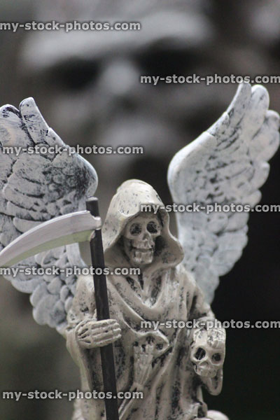 Stock image of model Halloween spooky town / village, miniature grim reaper, Angel of Death statue, skull