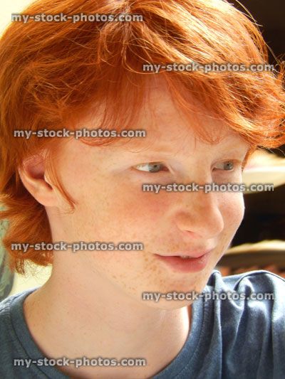 Stock image of portrait / profile of handsome teenage boy, ginger red hair