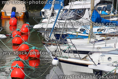 Stock image of harbour / marina with boats, yachts and red buoys