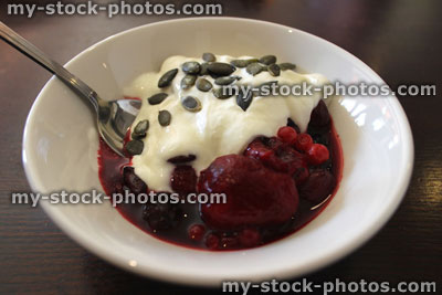 Stock image of healthy breakfast, with strawberries, yoghurt and pumpkin seeds