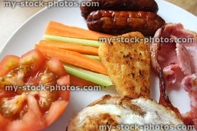Stock image of low calorie, full English fried breakfast with healthy elements, raw vegetables, diet