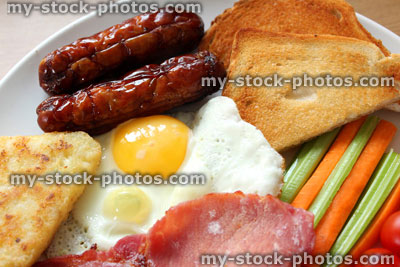 Stock image of low calorie, full English fried breakfast with healthy elements, raw vegetables, low calorie