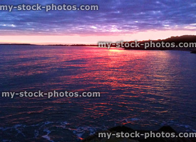 Stock image of sunset on English coastline, next to Highcliffe beach, Dorset