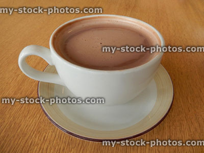Stock image of cup of hot chocolate, frothy drink, cup and saucer