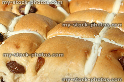 Stock image of homemade hot cross buns with white crosses, dried fruit