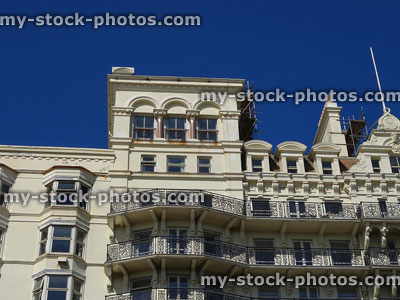 Stock image of Edwardian building with ornate ironwork balconies and scaffolding