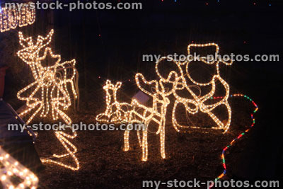 Stock image of white snowman, reindeer, Christmas tree lights, neon rope lights / fairy lights