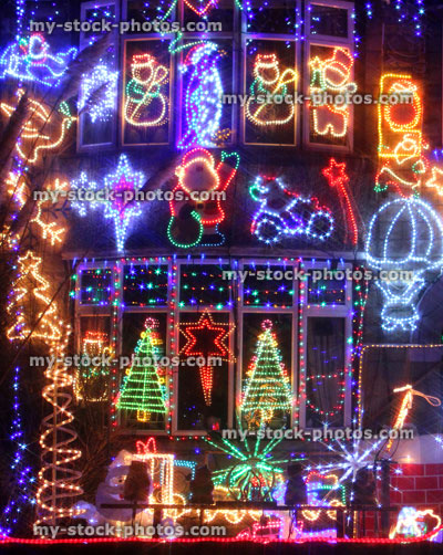 Stock image of house at night time, colourful Christmas lights / decorations, dark night