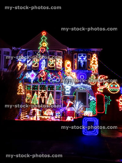 Stock image of house at night time, colourful Christmas lights / decorations, dark night