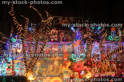 Stock image of Christmas house, colourful Christmas lights / decorations, dark night