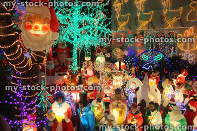 Stock image of house, colourful Christmas lights at night, night time illuminations