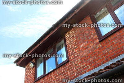 Stock image of red brick house extension, extended building, mortar colour