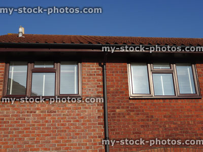 Stock image of extended house with red bricks, different colour mortar