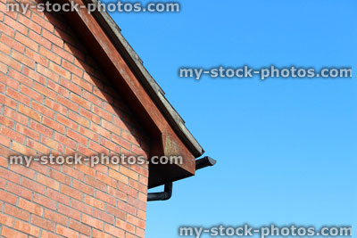Stock image of old wooden fascia boards on house, needing painting