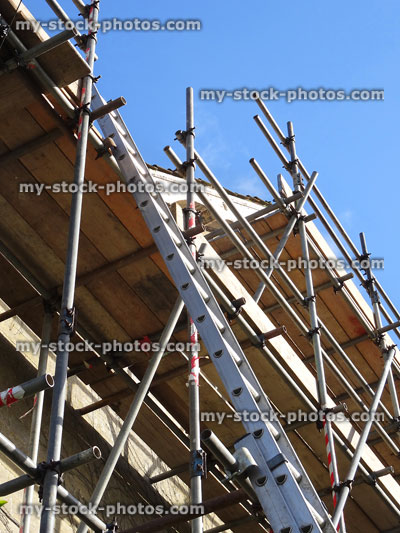 Stock image of scaffolding tower of metal poles and ladder, house repairs
