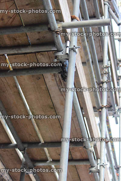 Stock image of scaffolding clamps / brackets, boards / planks, pipes / tubes